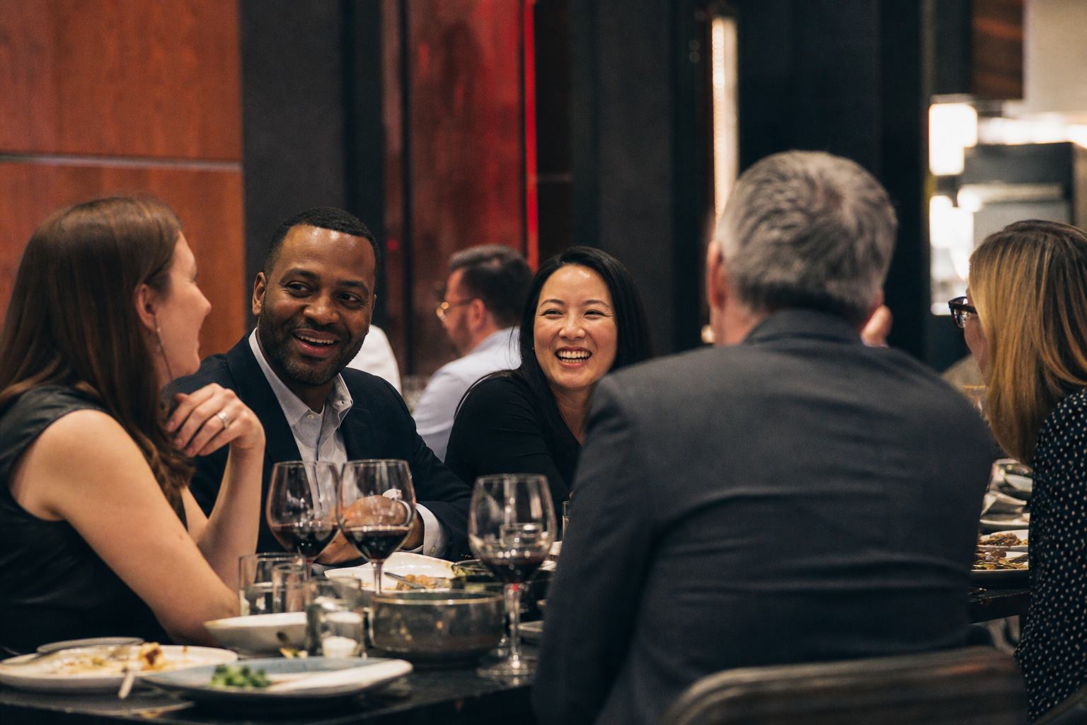 Technical professionals connecting over a team dinner